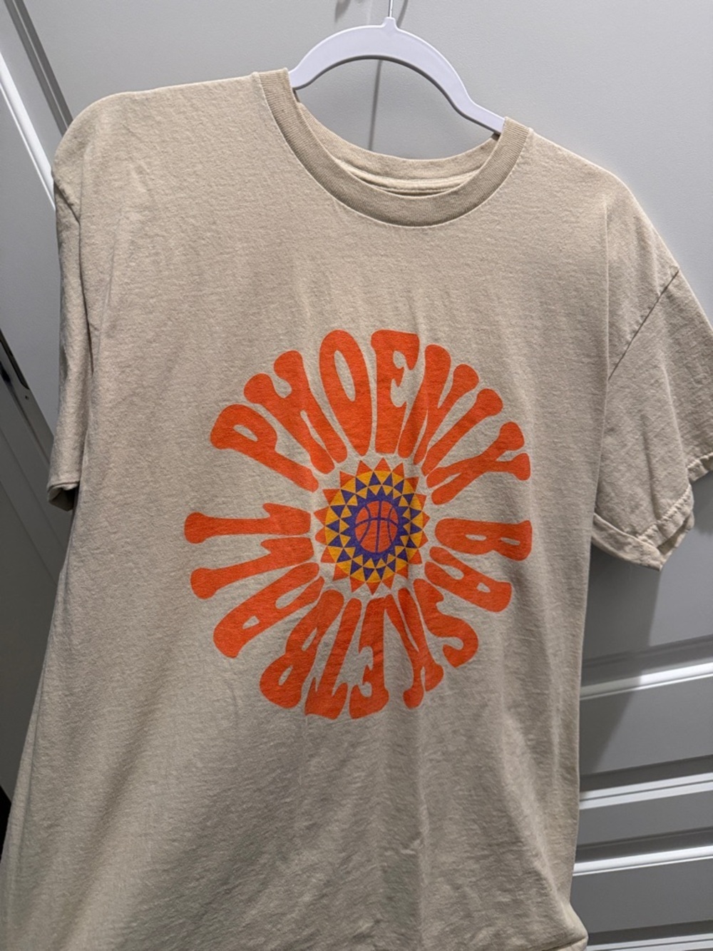 Beige Graphic Tee with Orange Phoenix Basketball Design